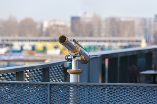 Telescope overlooking for city streets from above. Shot with a small GRIP