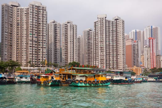 Traditional fishing trawlers in the Aberdeen bay, famous floating village in Hong Kong