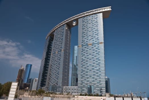 ABU DHABI, UAE - DECEMBER 24: Abu Dhabi streets with The Gate Towers skyscrapers on December 24, 2014. United Arab Emirates