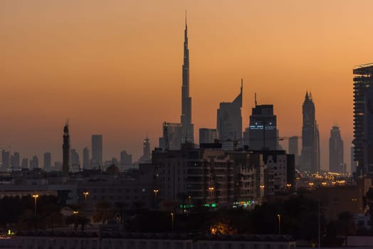 UAE, DUBAI - DECEMBER 27: view of Dubai cityscape from Dubai creek bank at night on December 27, 2014