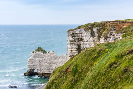 The beach and stone cliffs in Etretat, France, Normandy