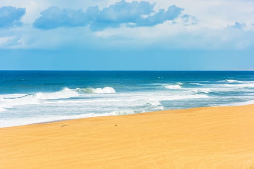 Long Sand Atlantic Beach with ocean waves. The Gironde Department, France. Shot with a selective focus