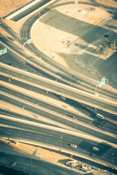 Top view of highway interchange in Dubai, UAE. Toned shot