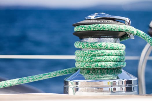 Winch with rope on sailing boat