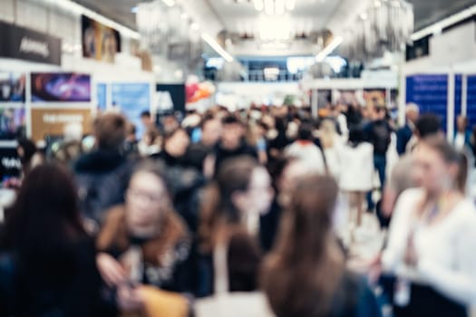 Abstract blurred people at exhibition hall of expo event trade show. Business convention show or job fair. Business concept background.