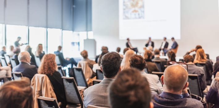 Interview and round table discussion at business convention and presentation. Audience at the conference hall. Business and entrepreneurship symposium.