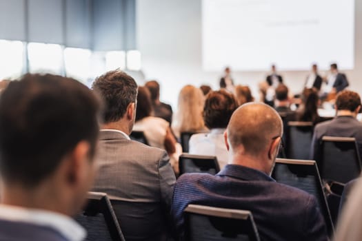 Interview and round table discussion at business convention and presentation. Audience at the conference hall. Business and entrepreneurship symposium.