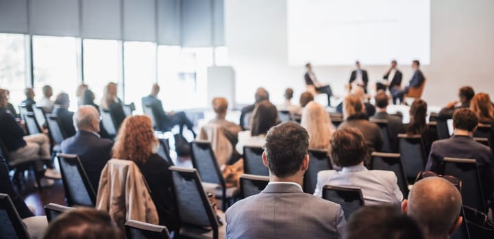 Interview and round table discussion at business convention and presentation. Audience at the conference hall. Business and entrepreneurship symposium.