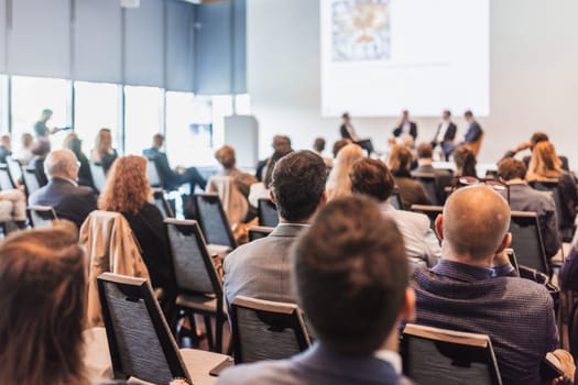 Interview and round table discussion at business convention and presentation. Audience at the conference hall. Business and entrepreneurship symposium.
