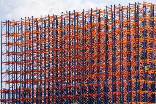 Red metal construction on the sky background