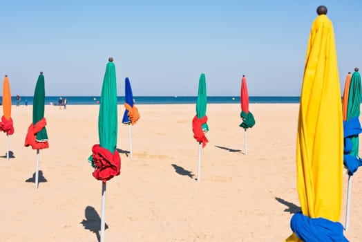 The famous colorful parasols on Deauville beach, Normandy, Northern France