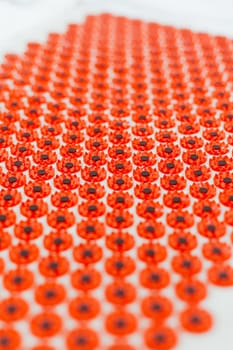 Acupuncture mat in bed. Wellness, reflexology and self care treatment at home concept. Alternative therapy massager with acupressure points. Reduce muscle tension, back pain, improve blood circulation