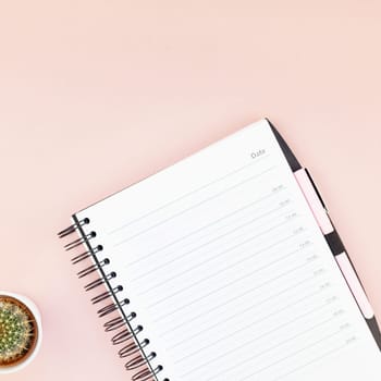 Top view flat lay workspace desk styled design office supplies cactuses succulents with copy space millennial pink color paper background minimal style. Square Template for feminine blog social media