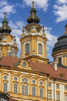 Melk, Austria - February 24, 2023: View of Melk Abbey with Collegiate Church towers on background of blue sky. It was was founded in 11th century, today's baroque abbey was built in 18th century