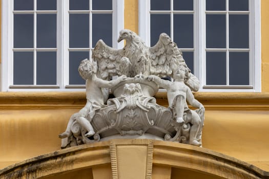 Melk, Austria - February 24, 2023: Melk Abbey on hill above town, decorative relief on facade. Monastery was founded in 11th century, today's baroque abbey was built in 18th century