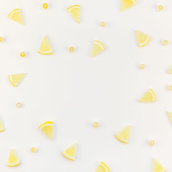 Square flatlay overhead top view citrus lemon slices pattern frame white table background with copyspace. Hot summer refreshment lemonade concept. Beverage ingredients arranged