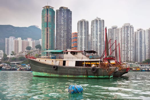 Traditional fishing trawlers in the Aberdeen bay, famous floating village in Hong Kong