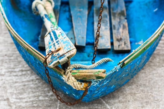 Old blue wooden shabby fishing boat detail. Shot with a selective focus
