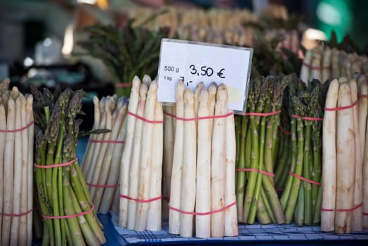 Fresh asparagus selling in a farmers market. Shot with a selective focus