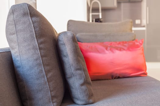 Modern apartments cozy furniture: a sofa with pillows