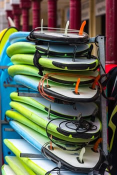 Set of different color surf boards in a stack. France
