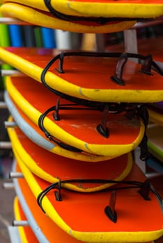 Set of different color surf boards in a stack. France
