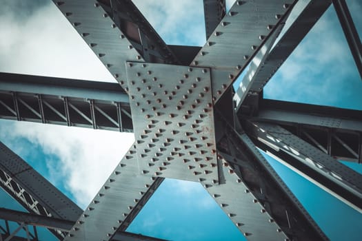 Bridge frame closeup on blue sky background. Horizontal toned image