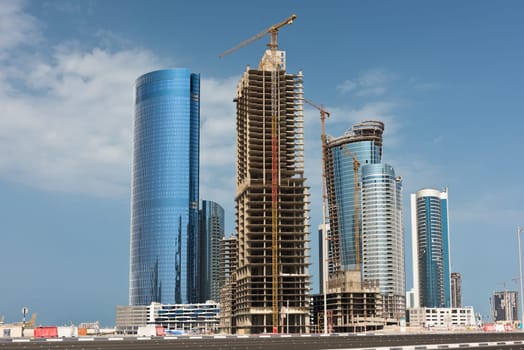 Abu Dhabi new district with skyscrapers construction. United Arab Emirates