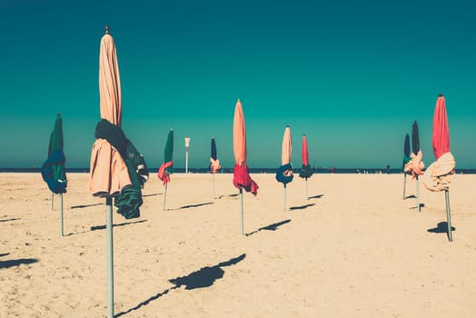 The famous colorful parasols on Deauville beach, Normandy, Northern France