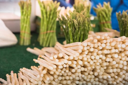 Fresh asparagus selling in a farmers market. Shot with a selective focus