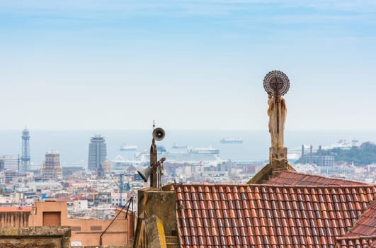 Buildings roofs in Barcelona, Spain. Cityscape and the sea as a background