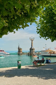 View of Lake Constance and the Imperia statue and cultural monument by sculptor Peter Lenk from the shore in Constance