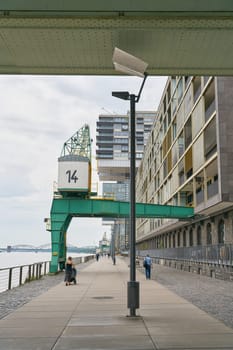 historic crane in the modern Rheinauhafen on the banks of the Rhine in Cologne