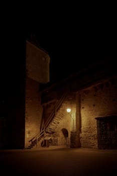 Medieval illuminated town wall at the Powder Tower, Pulverturm in Rothenburg ob der Tauber in Germany at night