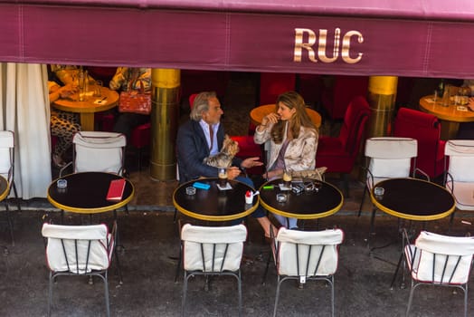 FRANCE, PARIS - JUNE 04: Parisian enjoy food and drinks in cafe sidewalk in Paris on June 04, 2015. Top view