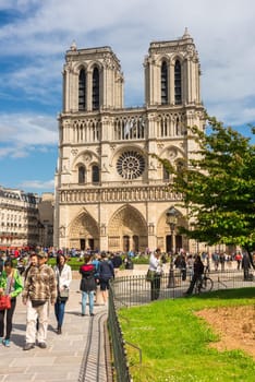 FRANCE, PARIS - JUNE 01: Tourists enjoy sightseeing near the Cathedral of Notre Dame in Paris on June 01, 2015