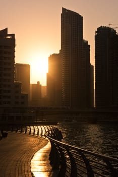 UAE, DUBAI - DECEMBER 31: Skyscrapers silhuette at sunset in Dubai marina on December 31, 2014. Contre jour shot