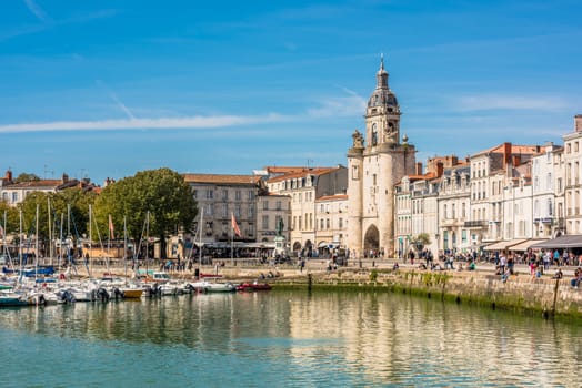 FRANCE, LA ROCHELLE - SEPTEMBER 21, 2015: View of people on the promenade in the old port of La Rochelle France