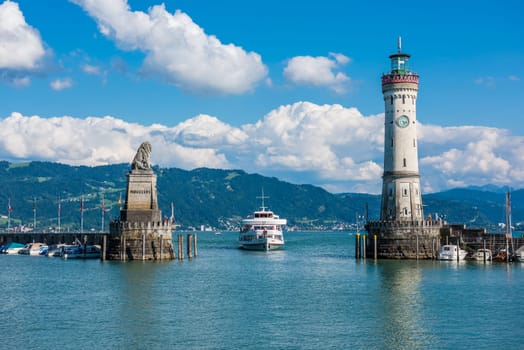 GERMANY, LINDAU - AUGUST 21: view of the lighthouse and a lion statue at the entrance to the port of Lindau at lake Constance, Bodensee on August 21, 2015