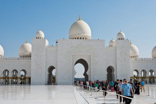 UAE, ABU DHABI - DECEMBER 24: People are visiting famous Sheikh Zayed White Mosque on December 24, 2014