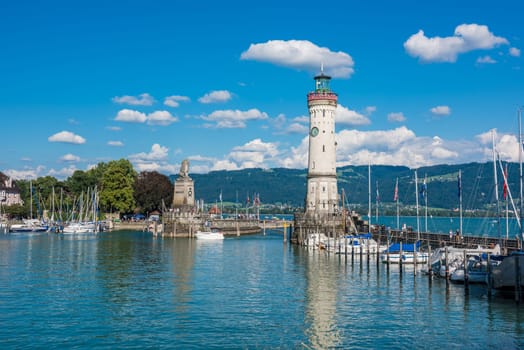 GERMANY, LINDAU - AUGUST 21: view of the lighthouse and a lion statue at the entrance to the port of Lindau at lake Constance, Bodensee on August 21, 2015