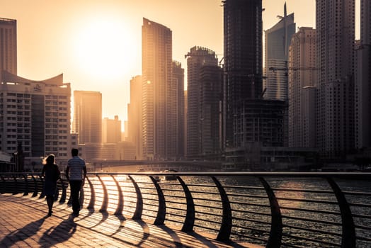 UAE, DUBAI - DECEMBER 31: Skyscrapers silhuette at sunset in Dubai marina on December 31, 2014. Contre jour shot