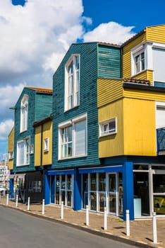 FRANCE, LA ROCHELLE - SEPTEMBER 21, 2015: Bright colorful houses on the seaside street in the port of La Rochelle, France