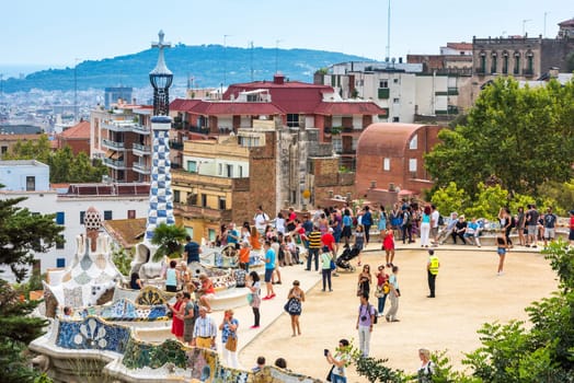 SPAIN, BARCELONA - SEPTEMBER 13: Tourists in Park Guell, Barcelona, Spain on September 13, 2015