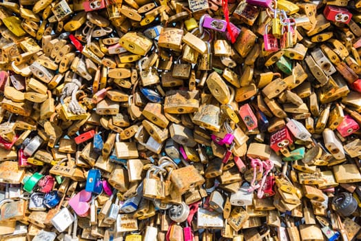 FRANCE, PARIS - JUNE 01: Pont des arts - bridge across Seine river crammed with lovers padlocks on June 01, 2015.