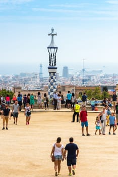 SPAIN, BARCELONA - SEPTEMBER 13: Tourists in Park Guell, Barcelona, Spain on September 13, 2015