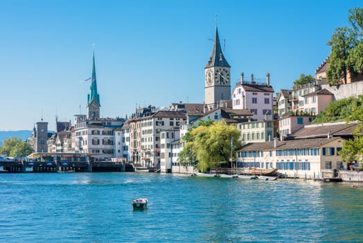 SWITZERLAND, ZURICH - AUGUST 22: view of historic Zurich city center with famous St. Peter and Fraumunster churches, Limmat river and Zurich lake on August 22, 2015
