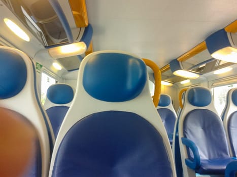 Interior view of a regional train empty seats