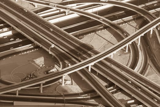 Top view of highway interchange in Dubai, UAE. Sepia toned