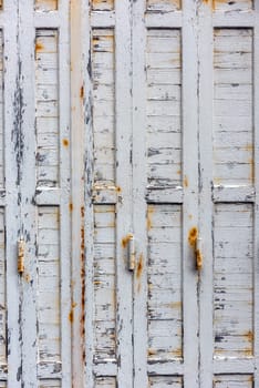 window with closed beige wooden shutters. background photo